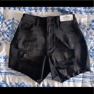 High-rise black Hollister shorts.